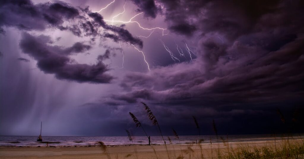 Dramatic lightning bolts illuminate the night sky over Redington Beach, creating a stunning natural scene.